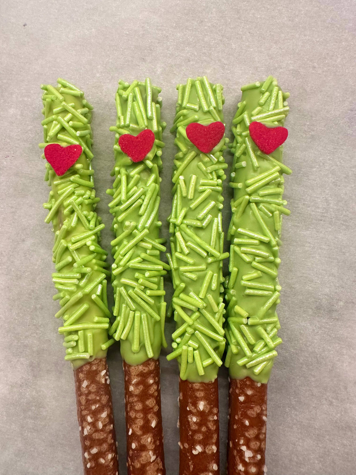 Holiday Green Sprinkle Chocolate Covered Pretzel Rods