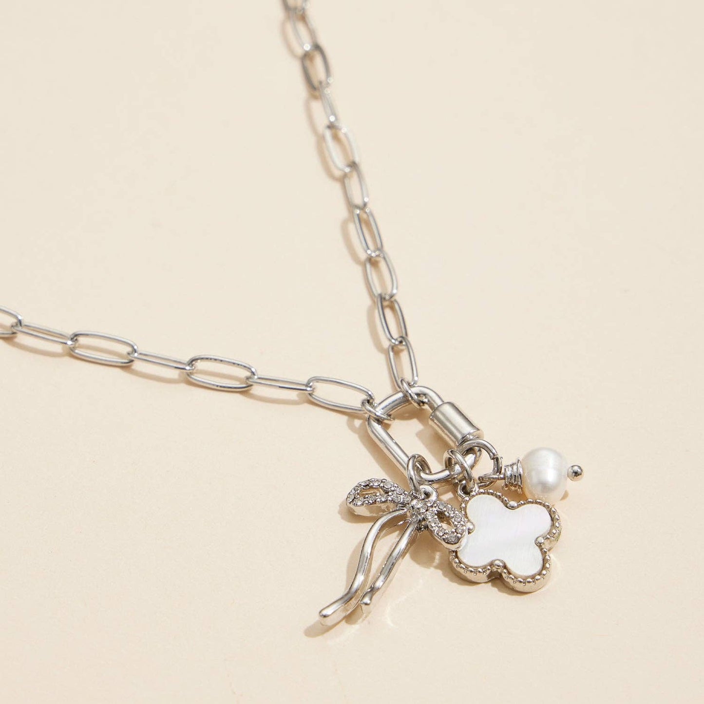 Gold Dipped Bow Charm Necklace with Clover and Pearl